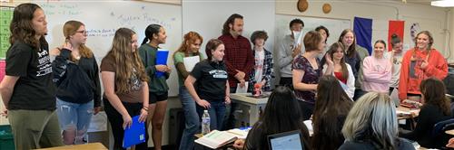 Choir performs in French II class